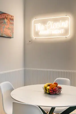 a white table with a bowl of fruit on it at The Ciccins Apartment in Rome by Hostand in Rome