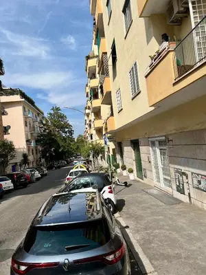a car parked in a parking lot next to a building at Lilia Charming Flat in Rome