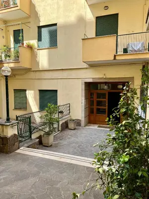 an apartment building with a door and a courtyard at Lilia Charming Flat in Rome