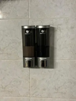 two coffee cups are hanging on a wall at Accogliente Appartamento Roma in Rome