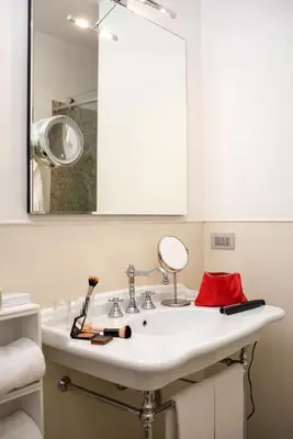 a bathroom with a sink and a mirror at The Fifteen Keys Hotel in Rome