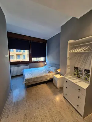 a bedroom with a bed and a dresser and a window at Nice house in Roma Esquilino Colosseum in Rome