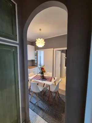 a kitchen and dining room with a table and chairs at Nice house in Roma Esquilino Colosseum in Rome