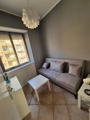 a living room with a couch and a table at Nice house in Roma Esquilino Colosseum in Rome