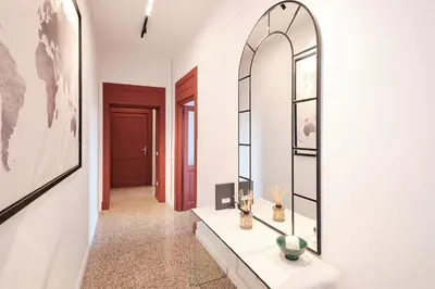 a dressing room with a mirror and a table at Elegant Apartment with view of Castel Sant'Angelo in Rome