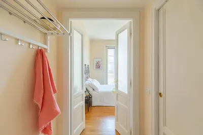 a hallway with a door leading to a bedroom at iFlat Bright & Comfy 2-Bedroom Apt near Vatican in Rome