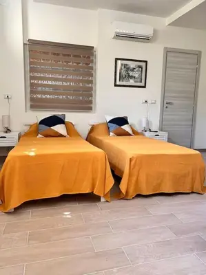 two beds sitting next to each other in a bedroom at Sunshine Eco Residence in Rome
