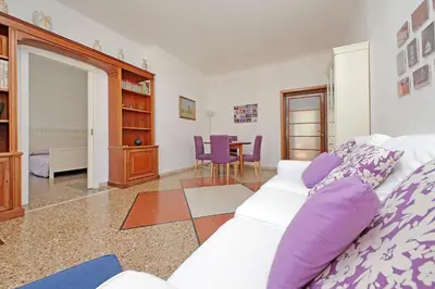 a living room with a white couch and a table at Flaminio in Rome