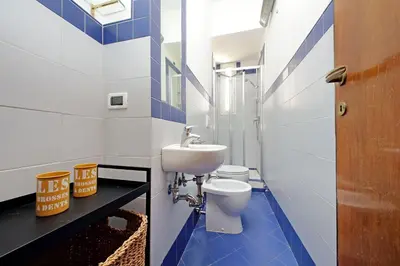 a bathroom with a toilet and a sink at Flaminio in Rome