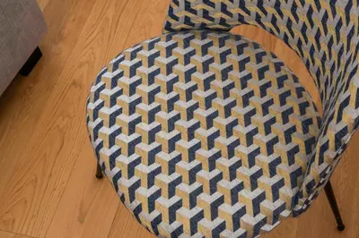 a chair with a rug on top of it at Monti Zen Penthouse-ZENO57 in Rome