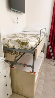a hallway with a marble floor and white walls at Mille Guest house 2 in Rome