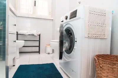 a washing machine in a bathroom with a toilet at Il giardino di San Pietro - 10 minuti dai Musei Vaticani in Rome