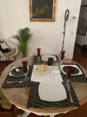 a table with plates of food on top of it at House Maximo at Colosseum in Rome