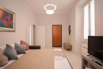 a living room with a couch and a tv at Rome Flat 42 by GHOR in Rome