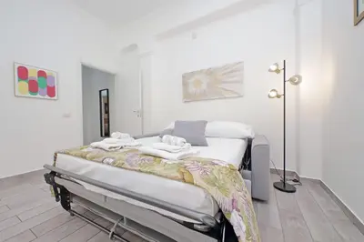 a white room with a hospital bed in it at 4BNB - Cavalleggeri Apartment in Rome