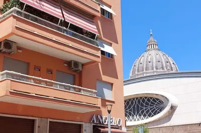a building with a dome and a building with a building at 4BNB - Cavalleggeri Apartment in Rome