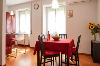 a dining room with a table with a red table cloth at Pigneto Holiday in Rome