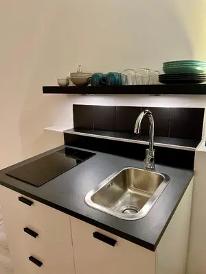 a kitchen with a sink and a counter top at Charming Navona - The Loft in Rome