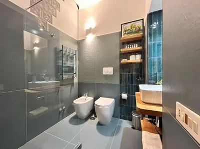 a bathroom with a toilet and a sink at Elegant 3 bedrooms apartment Colosseum - San Giovanni in Rome