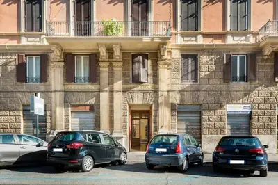three cars parked in front of a building at Appartamento elegante Castel Sant'Angelo in Rome