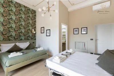 a bedroom with two beds and a wall mural at Gemma House - 100mt to Metro Station, 2 En-Suite bathrooms in Rome