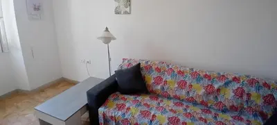 a living room with a couch and a table at Cosy Apartment - 5 Minutes Walk from Colosseum in Rome