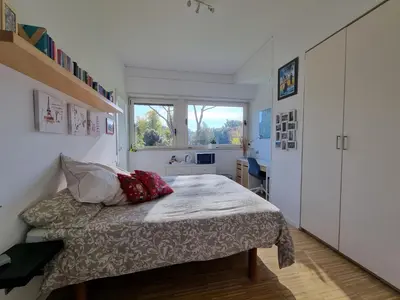 a small bedroom with a bed and a window at Parco della Musica House in Rome
