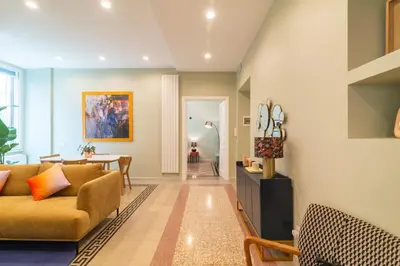 a living room with a couch and a table at Casa Barbieri boutique apartment Flaminio in Rome
