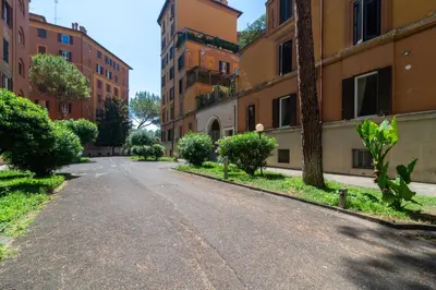 an empty street in a city with buildings at Casa Barbieri boutique apartment Flaminio in Rome