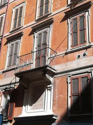 a building with a balcony on the side of it at Little gem in Trevi Fountain in Rome