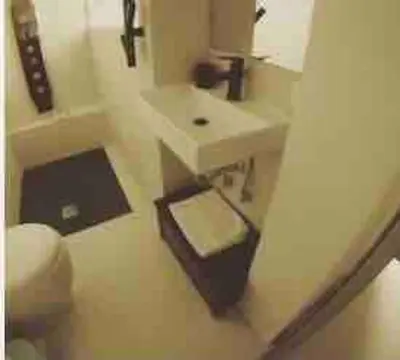 a bathroom with a white sink and a mirror at Little gem in Trevi Fountain in Rome