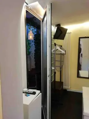 a bathroom with a shower and a toilet at Little gem in Trevi Fountain in Rome