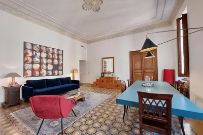 a living room with a blue table and a couch at Monti in Rome