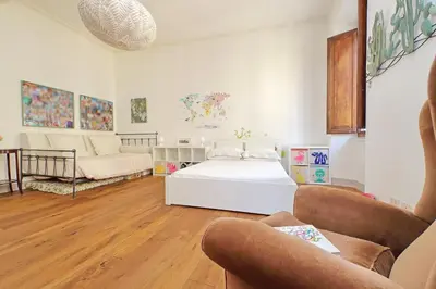 a living room with a bed and a couch at Monti in Rome