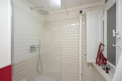 a bathroom with a shower with a glass door at Monti in Rome