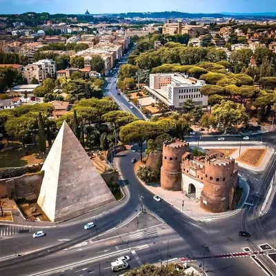 an aerial view of a city with a pyramid and a street at Elena's Apartment - Piramide Metro Station in Rome