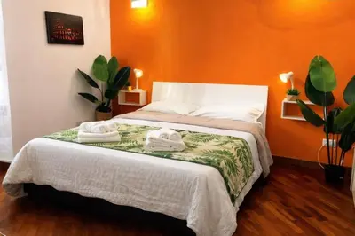 a bedroom with a bed with towels on it at Apartment Cerri 2 in Rome