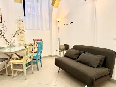 a living room with a couch and a table at Garbatella Vintage in Rome