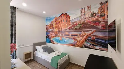 a bedroom with a large painting on the wall at Susy's Guest House - Room Spagna in Rome