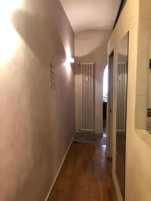 a hallway with a wall with a sign on it at Giancarla Luxury Apartment Rome San Lorenzo - Termini in Rome