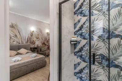 a living room with a table and a desk at Napolehome Luxury Apartment in Rome