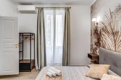 a bedroom with a bed and a window at Napolehome Luxury Apartment in Rome