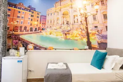 a bedroom with a mural of a city at Susy's Guest House - Room Trevi in Rome