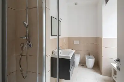 a bathroom with a shower and a sink and a toilet at New apartment near Piazza del Popolo in Rome