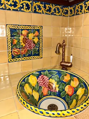 a bathroom sink with a floral design on it at Romeantique in Zama in Rome