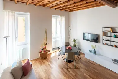a living room with a couch and a table at iFlat Modern & Relaxing apartment in Trastevere in Rome