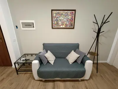 a living room with a couch and a table at Locazioni Ostiense - Joy House in Rome