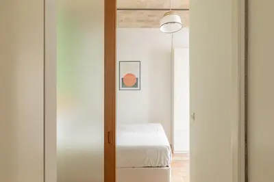 a bedroom with a door leading to a bed at iFlat Quiet & cozy apt a few steps from Vatican in Rome