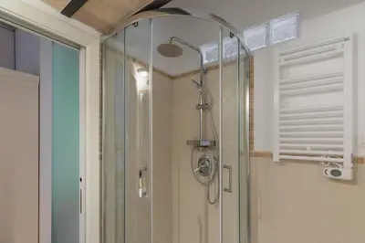 a shower in a bathroom with a glass door at iFlat Quiet & cozy apt a few steps from Vatican in Rome