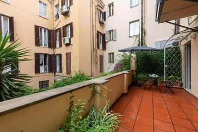 a balcony of a building with a patio at My Spanish Steps Apartment - 2 bathrooms in Rome